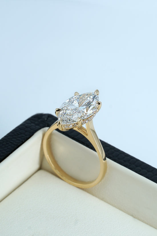 Bellla 3 ct  Marquise solitaire in 18k yellow  gold with hidden halo