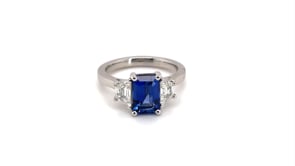 Trilogy Style Blue Sapphire with Tapered Baguettes on the side