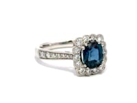 Teal Sapphire oval brilliant cut with Halo and diamond shoulders