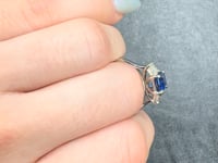 Trilogy Style Blue Sapphire with Tapered Baguettes on the side